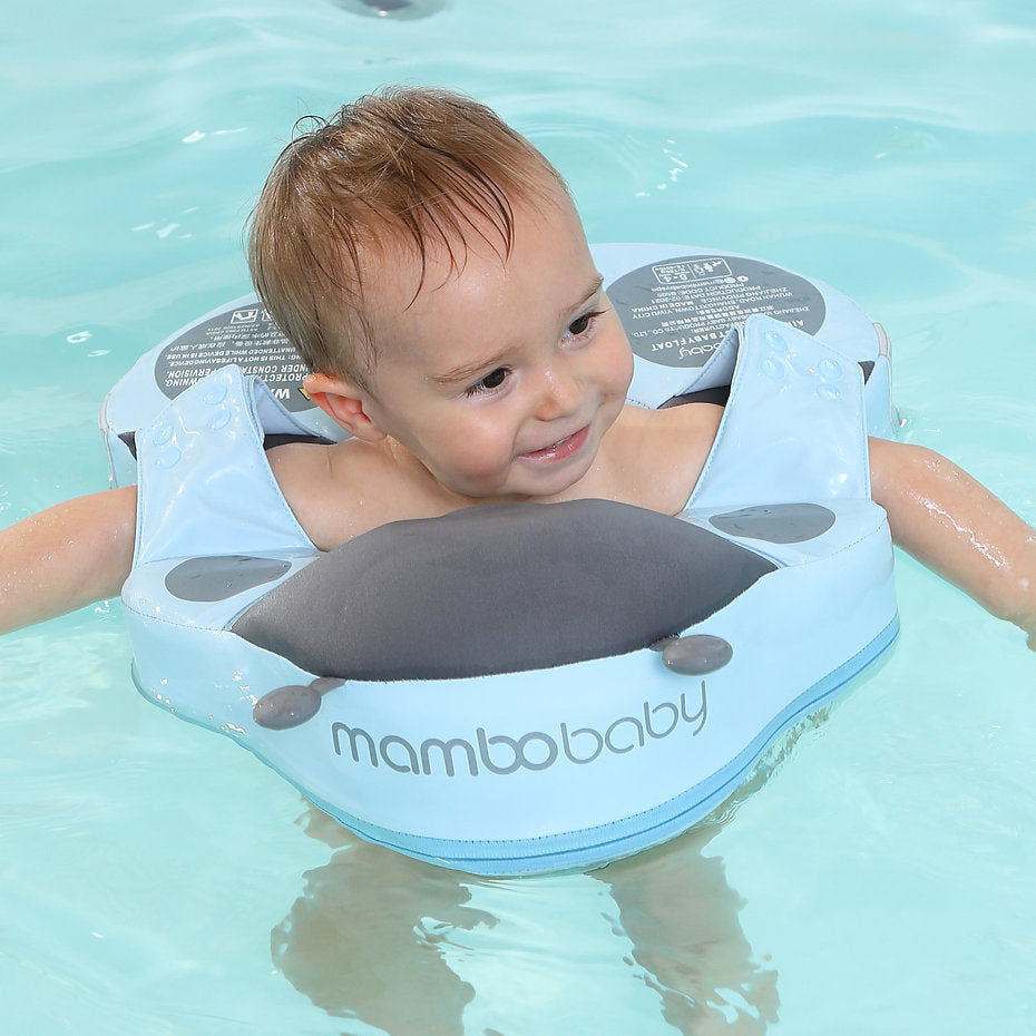 Demonstration of active swimming positions using the Mambobaby Ladybug float to promote toddler muscle coordination.