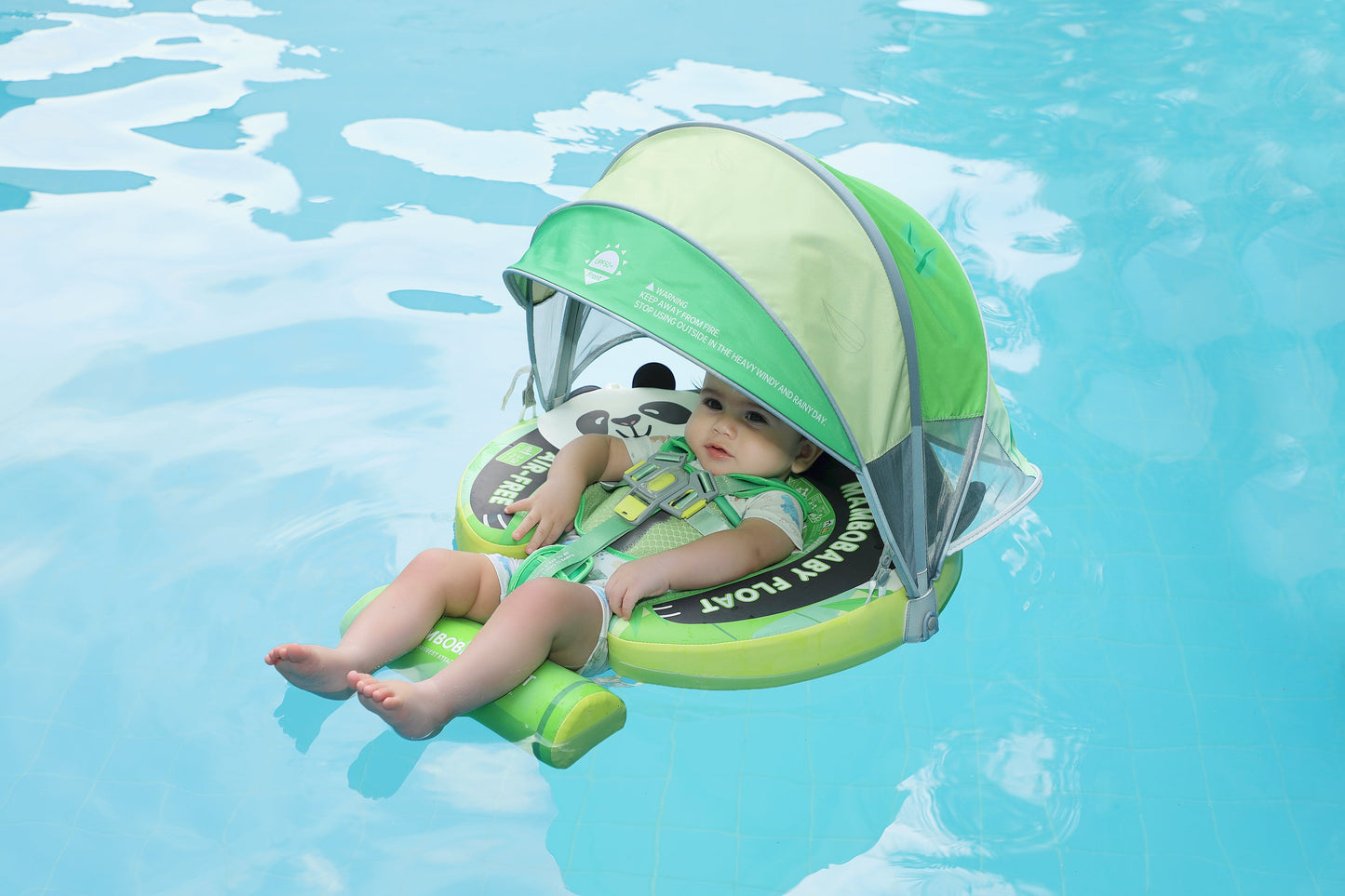 Newborn relaxing in the Mambobaby Panda float in backstroke mode, building water confidence and aquatic trust.