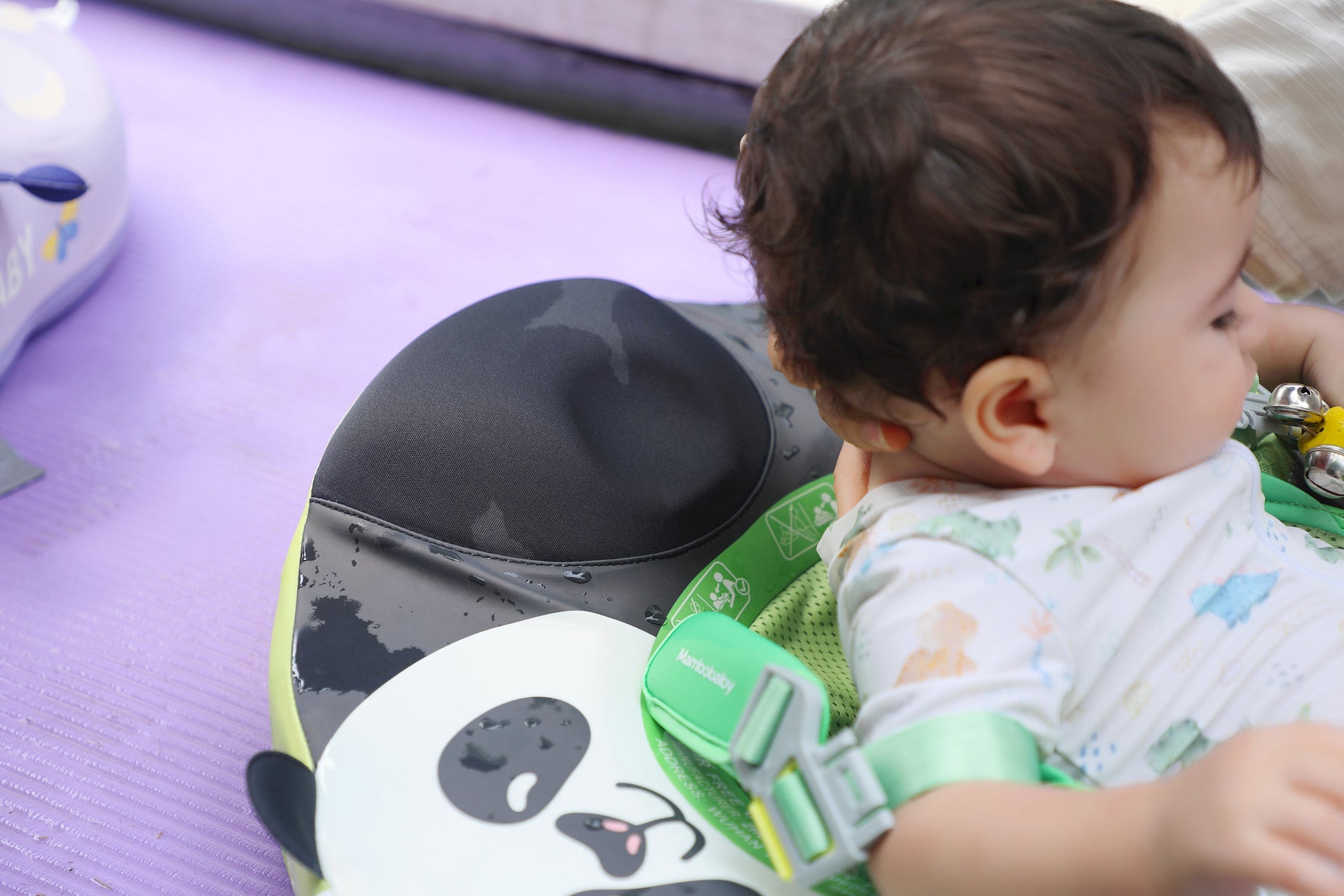 Newborn relaxing in the Mambobaby Panda float in backstroke mode, building water confidence and aquatic trust.
