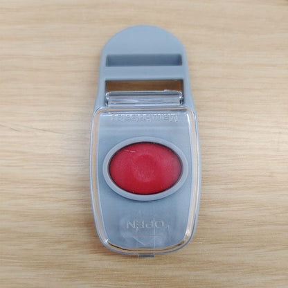 The quick-release unlock button of a Mambobaby™ float, designed for easy adult access while remaining secure from babies.