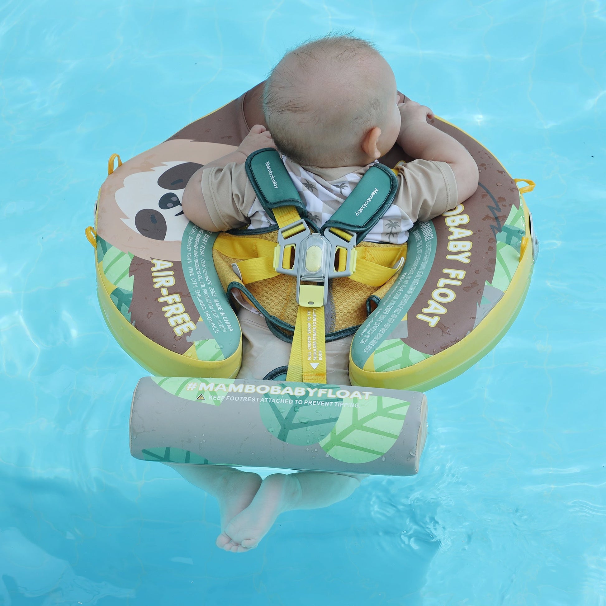 Newborn using the Mambobaby Sloth float for hydrotherapy in a calm pool, promoting motor skill development and relaxation.